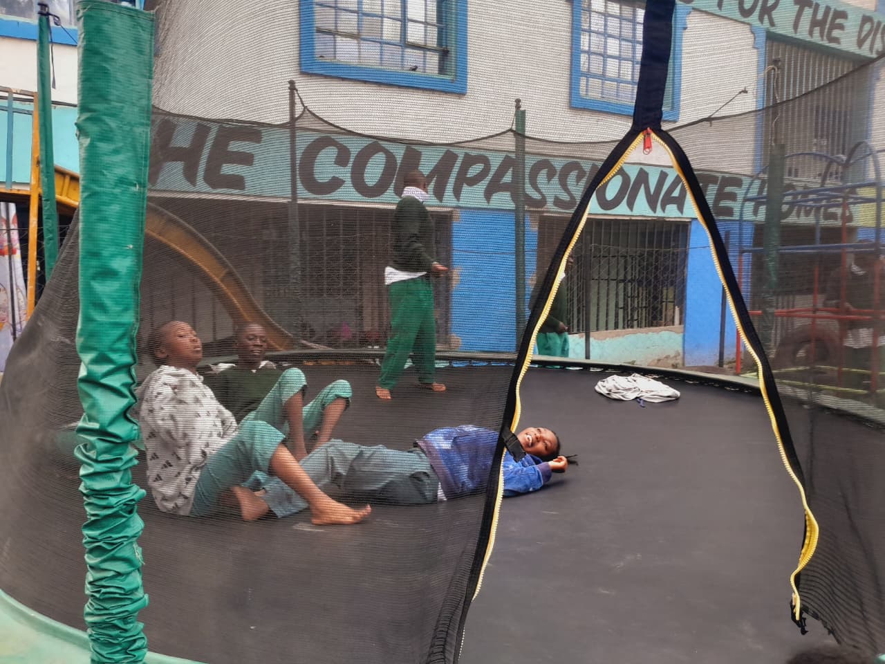 Children relaxing on the trampoline at CHDF