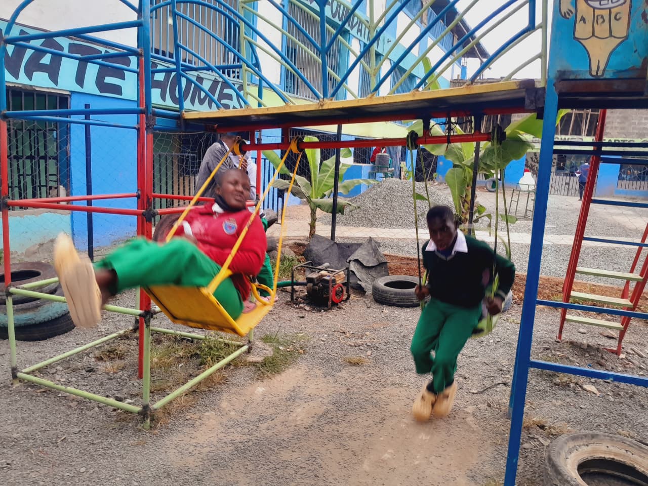 Students enjoying the swings at CHDF