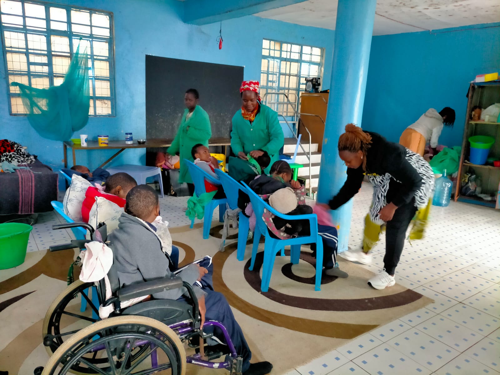 Children and caregivers in the day room
