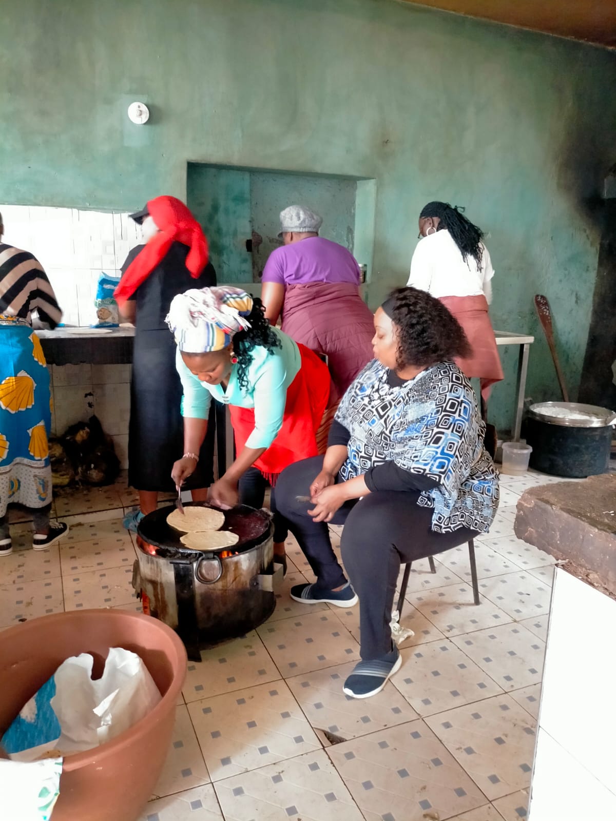 Volunteers cooking chapati
